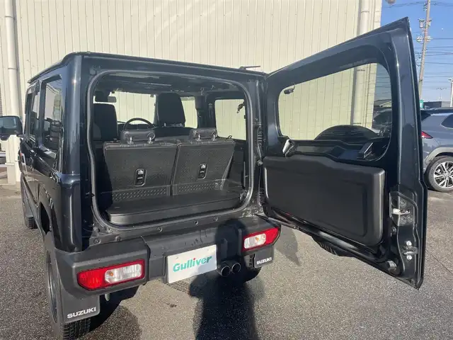 スズキ ジムニー XL 富山県 2024(令6)年 3.3万km ブルーイッシュブラックパール3 革調シートカバー/社外７インチナビ／/フルセグＴＶ／/Ｂｌｕｅｔｏｏｔｈ／/ＤＶＤ再生／/リフトアップサスペンション／/社外マフラー／/ＥＴＣ／/シートヒーター／/スマートキー／/プッシュスタート／/室内ルーフキャリア