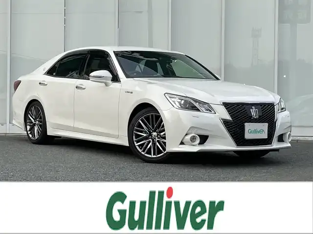 トヨタ クラウン ハイブリッド アスリートG 福岡県 2014(平26)年 10.6万km ホワイトパールクリスタルシャイン 純正ナビ/（AM/FM/CD/DVD/HDD/USB/BT/ワンセグ）/レーダークルーズコントロール/前後コーナーセンサー/ワンオーナー/社外アルミホイール付きスタッドレスタイヤ4本（215/55/17）/ETC/バックカメラ/前方ドライブレコーダー/レザーシート/D+N席パワーシート/D+N席シートヒーター/D+N席エアシート/D席メモリーシート/純正18インチアルミホイール/オートライト/フォグランプ/オートハイビーム/フロアマット/MT付きAT/ステアリングスイッチ/純正ドアバイザー/オート電動格納ミラー/スマートキー/プッシュスタート/リアサンシェード/W+カーテンエアバッグ/DUALオートエアコン/ISO FIX