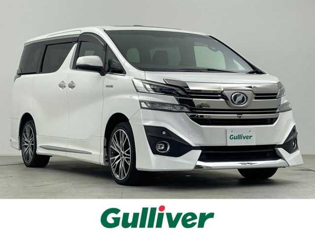トヨタ ヴェルファイア ハイブリット エグゼクティブ ラウンジ 千葉県 2017(平29)年 5万km ホワイトパールクリスタルシャイン 4WD/モデリスタエアロ/Wサンルーフ/フリップダウンモニター/トヨタセーフティセンス/・プリクラッシュセーフティ/・オートハイビーム/・トラクションコントロール/純正9インチSDナビ/CD MSV BT AUX フルセグ/アラウンドビューモニター/JBLサウンドシステム/両側パワースライドドア/パワーバックドア/アダプティブクルーズコントロール/全席レザーシート/メモリ機能付きパワーシート/前席シートヒーター/パーキングスイッチ/ブレーキホールド/革巻きステアリング/ステアリングスイッチ/純正フロアマット/ドアバイザー/ビルトインETC