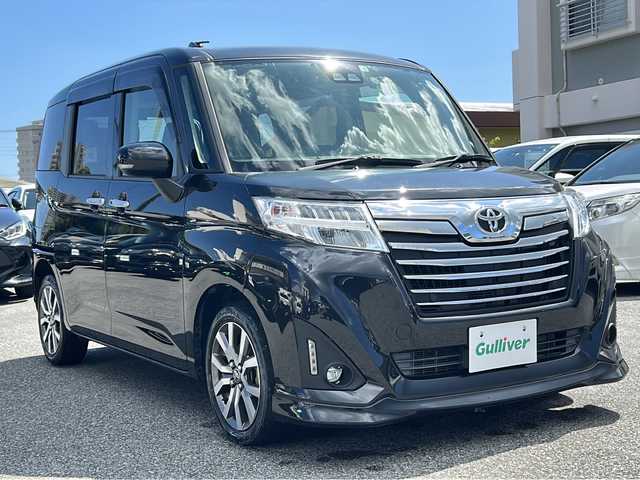 トヨタ ルーミー カスタムG－T 沖縄県 2020(令2)年 2.7万km ブラックマイカメタリック 純正ナビ/フルセグTV/バックカメラ/（BT/CD/DVD)/プリクラッシュセーフティー/クルーズコントロール/コーナーセンサー/横滑り防止装置/両側パワースライドドア/純正フロアマット/純正アルミホイール/アイドリングストップ/シートヒーター/革巻きステアリング/LEDヘッドライト/フォグランプ/オートライト/オートマチックハイビーム