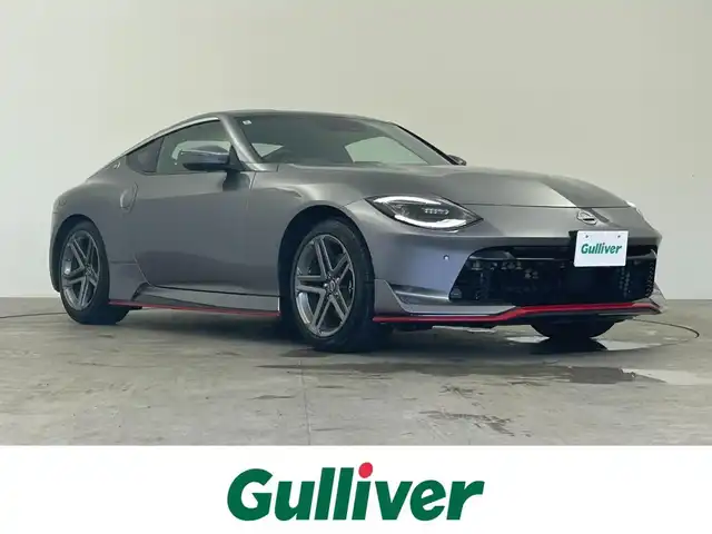 日産 フェアレディ Ｚ 千葉県 2024(令6)年 0.9万km ダークメタルグレー 6速MT/ワンオーナー/メーカーオプションナビ/・BT/TV/USB/AndroidAuto/バックカメラ/スポーツモード/ニスモエアロ/インテリジェントキー/スペアキー/プッシュスタートボタン/ビルトインETC2.0/革巻きステアリング/ステアリングスイッチ/Autoライト/レーダークルーズコントロール/オートマチックハイビーム/インテリジェントレーダーブレーキ/横滑り防止/LEDヘッドライト/フォグランプ/純正18インチアルミホイール/フロアマット/保証書/取扱説明書