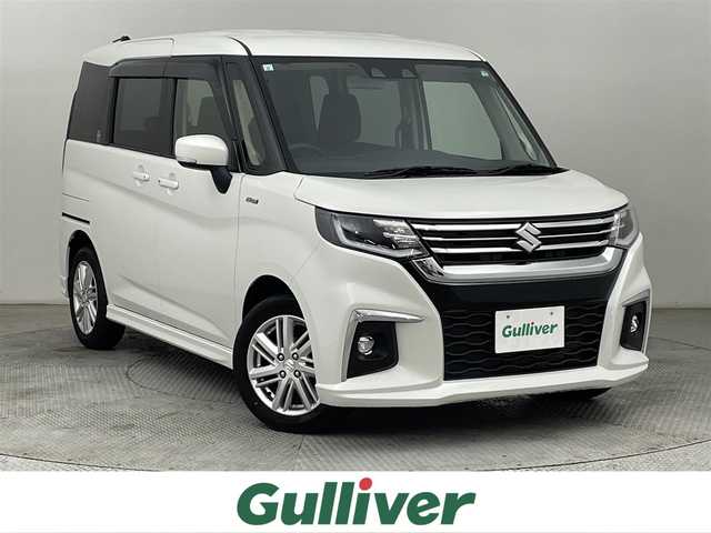 スズキ ソリオ HV MZ 道央・札幌 2023(令5)年 0.9万km ピュアホワイトP ・ワンオーナー/・４WD/・８インチナビ/　CD/DVD/SD/BT/フルセグ/・バックカメラ/・ビルトインETC/・デュアルカメラサポートブレーキ/・レーダークルーズコントロール/・レーンキープアシスト/・オートハイビーム/・クリアランスソナー/・両側パワースライドドア/・前席シートヒーター/・LEDヘッドライト/・フォグライト/・オートライト/・プッシュスタート/・スマートキー/・純正フロアマット/・ドアバイザー
