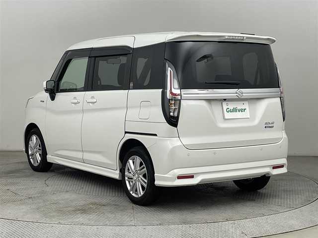 スズキ ソリオ HV MZ 道央・札幌 2023(令5)年 0.9万km ピュアホワイトP ・ワンオーナー/・４WD/・８インチナビ/　CD/DVD/SD/BT/フルセグ/・バックカメラ/・ビルトインETC/・デュアルカメラサポートブレーキ/・レーダークルーズコントロール/・レーンキープアシスト/・オートハイビーム/・クリアランスソナー/・両側パワースライドドア/・前席シートヒーター/・LEDヘッドライト/・フォグライト/・オートライト/・プッシュスタート/・スマートキー/・純正フロアマット/・ドアバイザー