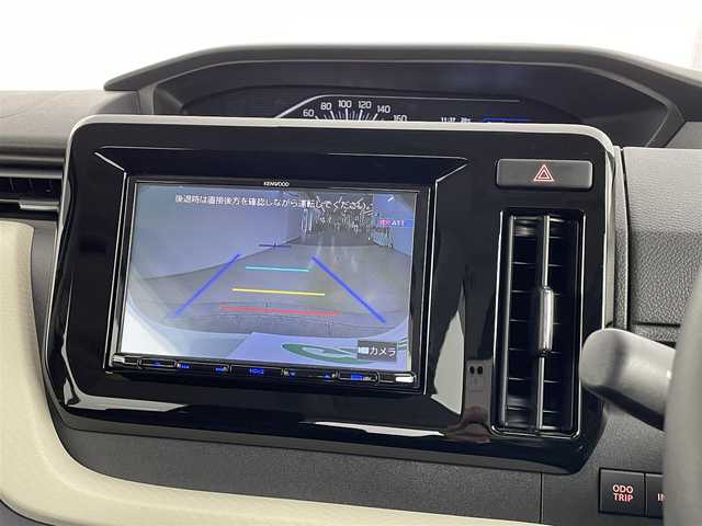 スズキ ソリオ HV MZ 道央・札幌 2023(令5)年 0.9万km ピュアホワイトP ・ワンオーナー/・４WD/・８インチナビ/　CD/DVD/SD/BT/フルセグ/・バックカメラ/・ビルトインETC/・デュアルカメラサポートブレーキ/・レーダークルーズコントロール/・レーンキープアシスト/・オートハイビーム/・クリアランスソナー/・両側パワースライドドア/・前席シートヒーター/・LEDヘッドライト/・フォグライト/・オートライト/・プッシュスタート/・スマートキー/・純正フロアマット/・ドアバイザー