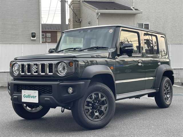 スズキ ジムニー ノマド FC 栃木県 2025(令7)年 0.1万km未満 緑 ・4WD/・ワンオーナー/・スズキセーフティサポート/・デュアルブレーキサポート/・誤発進抑制機能/・ふらつき警報機能/・標識認識機能/・先行車発進お知らせ機能/・レーダークルーズコントロール/・センターデフロック/・純正１５インチAW/・シートヒーター/・ダウンヒルアシストコントロール/・オートマチックハイビーム/・オートライト/・ヘッドライトウォッシャー/・LEDヘッドライト/・フォグランプ/・D/Nシートヒーター/・スマートキー/・アイドリングストップ/・ドアミラーヒーター/・横滑り防止/・取扱説明書/・保証書/・スペアキー１