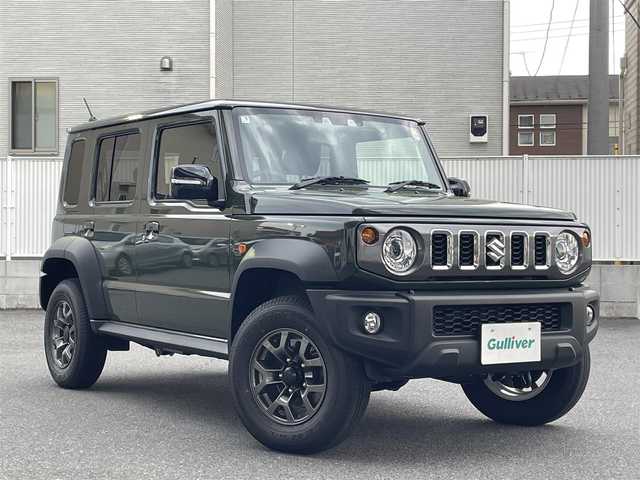 スズキ ジムニー ノマド FC 栃木県 2025(令7)年 0.1万km未満 緑 ・4WD/・ワンオーナー/・スズキセーフティサポート/・デュアルブレーキサポート/・誤発進抑制機能/・ふらつき警報機能/・標識認識機能/・先行車発進お知らせ機能/・レーダークルーズコントロール/・センターデフロック/・純正１５インチAW/・シートヒーター/・ダウンヒルアシストコントロール/・オートマチックハイビーム/・オートライト/・ヘッドライトウォッシャー/・LEDヘッドライト/・フォグランプ/・D/Nシートヒーター/・スマートキー/・アイドリングストップ/・ドアミラーヒーター/・横滑り防止/・取扱説明書/・保証書/・スペアキー１