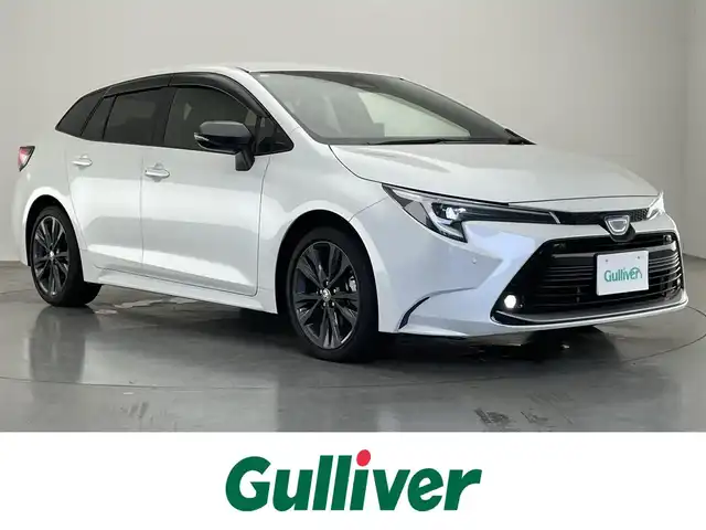 トヨタ カローラツーリング ハイブリッド ダブルバイビー 愛知県 2023(令5)年 3.9万km プラチナホワイトパールマイカ 純正１０．５型ナビ　BSM　追従クルコン　セーフティセンス　禁煙　フルセグ　黒ハーフレザー　Bluetooth　バックカメラ　車線逸脱　衝突軽減　ETC　USB　コーナーセンサー　LEDライト　フォグ　純正マット　ミラキャスト　電子パーキング　スマートキー　プッシュスタート