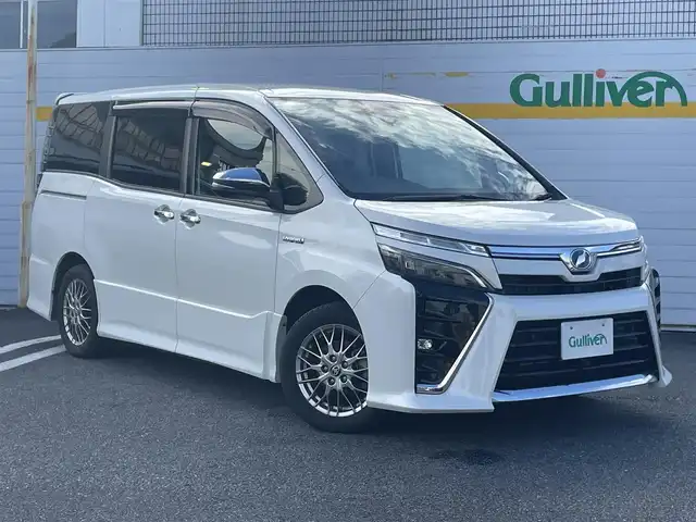 トヨタ ヴォクシー ハイブリッド ZS 煌Ⅱ 埼玉県 2019(平31)年 4.3万km ホワイトパールクリスタルシャイン ・純正ナビ/・純正フリップダウンモニター/・トヨタセーフティセンス/・レザー調シートカバー/・シートヒーター/・クルーズコントロール/・ドライブレコーダー/・コーナーセンサー/・バックカメラ