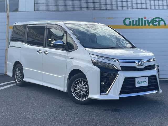 トヨタ ヴォクシー ハイブリッド ZS 煌Ⅱ 埼玉県 2019(平31)年 4.3万km ホワイトパールクリスタルシャイン ・純正ナビ/・純正フリップダウンモニター/・トヨタセーフティセンス/・レザー調シートカバー/・シートヒーター/・クルーズコントロール/・ドライブレコーダー/・コーナーセンサー/・バックカメラ