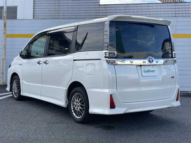 トヨタ ヴォクシー ハイブリッド ZS 煌Ⅱ 埼玉県 2019(平31)年 4.3万km ホワイトパールクリスタルシャイン ・純正ナビ/・純正フリップダウンモニター/・トヨタセーフティセンス/・レザー調シートカバー/・シートヒーター/・クルーズコントロール/・ドライブレコーダー/・コーナーセンサー/・バックカメラ