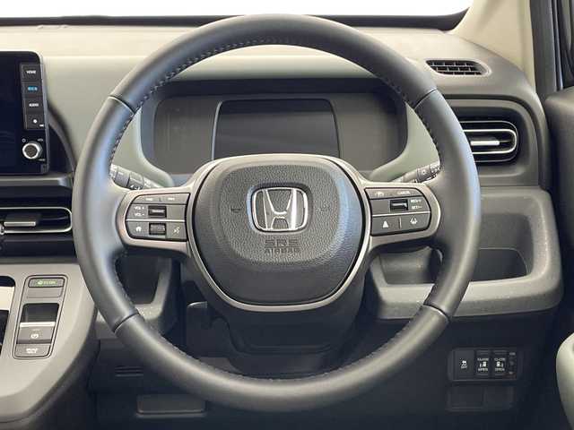 ホンダ フリード ハイブリット e:HEV クロスター 新潟県 2025(令7)年 0.1千km クリスタルブラックパール ホンダセンシング/9インチナビ（BT/CarPlay/AndroidAuto）/バックカメラ/両側パワースライドドア/シートヒーター/オートエアコン/オートライト/オートマチックハイビーム/衝突軽減システム/スマートキー/プッシュスタート/スペアキー/LEDヘッドライト/カーテンエアバック/ブラインドスポットモニター/レーンキープアシスト/保証書/取説/レザーステアリング/ステアリングスイッチ