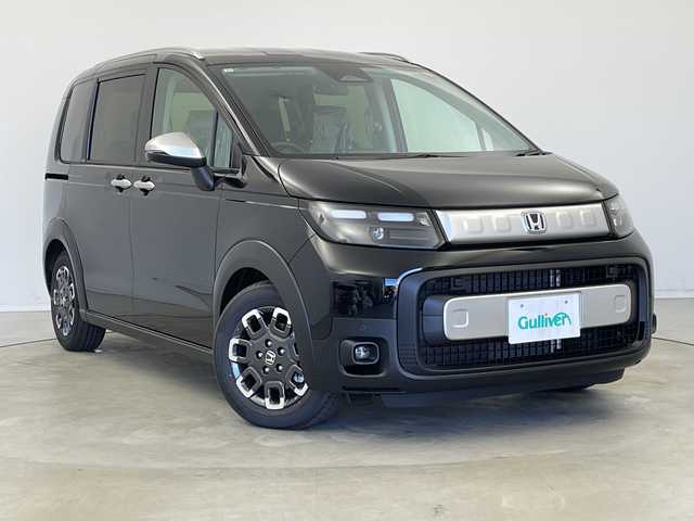 ホンダ フリード ハイブリット e:HEV クロスター 新潟県 2025(令7)年 0.1千km クリスタルブラックパール ホンダセンシング/9インチナビ（BT/CarPlay/AndroidAuto）/バックカメラ/両側パワースライドドア/シートヒーター/オートエアコン/オートライト/オートマチックハイビーム/衝突軽減システム/スマートキー/プッシュスタート/スペアキー/LEDヘッドライト/カーテンエアバック/ブラインドスポットモニター/レーンキープアシスト/保証書/取説/レザーステアリング/ステアリングスイッチ