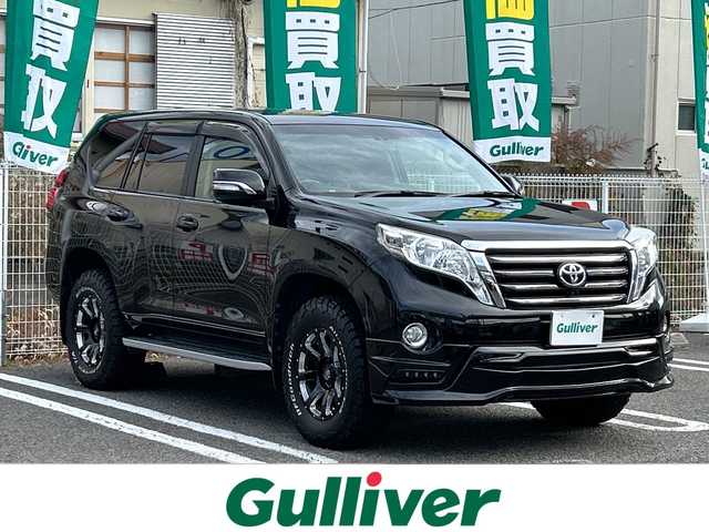 トヨタ ランドクルーザー プラド TX Lパッケージ 兵庫県 2014(平26)年 7.5万km ブラック 社外9型ナビ/CD/DVD/フルセグTV/Bluetooth/HDMI端子/バックカメラ/ETC/社外ジャオスフロントエアロ/社外レイズフルクロス17インチAW/（純正AWスタッドレス付4本積込）/社外エムクライムマフラー（純正積込）/LEDヘッドランプ（純正有）/後期テール仕様（純正有）/社外グリル（純正有）/社外シートカバー/社外エアクリーナー/社外フロアマット/他社外パーツ有（他純正パーツ有）/前後ドライブレコーダー（前360度）/ウッドコンビハンドル/前席シートヒーター/パワーシート/トノカバー/保証書/取説/スペアキー