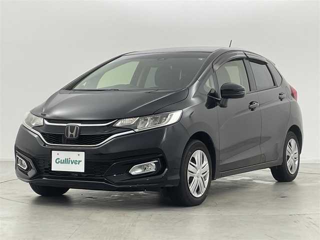 ホンダ フィット 13G L ホンダセンシング 群馬県 2019(令1)年 4.2万km クリスタルブラックパール 社外ナビ(CN-RE05D)/AM/FM/CD/DVD/BT/フルセグ/バックカメラ/ETC/ホンダセンシング/・衝突軽減ブレーキ〈CMBS〉/・誤発進抑制機能/・歩行者事故低減ステアリング/・路外逸脱抑制機能/・ACC〈アダプティブ・クルーズ・コントロー〉/・LKAS〈車線維持支援システム〉/・先行車発進お知らせ機能/・標識認識機能/アイドリングストップ/LEDヘッドライト/175/70R14 アルミホイール付きスタッドレスタイヤ4本車載/スマートキー/プッシュスタート