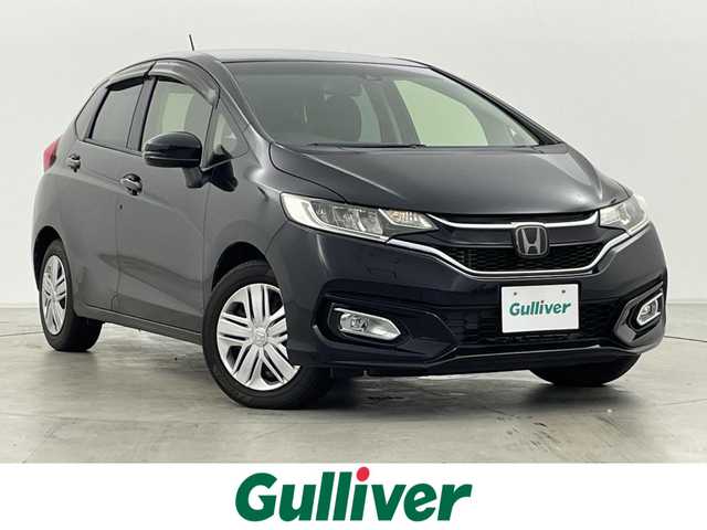 ホンダ フィット 13G L ホンダセンシング 群馬県 2019(令1)年 4.2万km クリスタルブラックパール 社外ナビ(CN-RE05D)/AM/FM/CD/DVD/BT/フルセグ/バックカメラ/ETC/ホンダセンシング/・衝突軽減ブレーキ〈CMBS〉/・誤発進抑制機能/・歩行者事故低減ステアリング/・路外逸脱抑制機能/・ACC〈アダプティブ・クルーズ・コントロー〉/・LKAS〈車線維持支援システム〉/・先行車発進お知らせ機能/・標識認識機能/アイドリングストップ/LEDヘッドライト/175/70R14 アルミホイール付きスタッドレスタイヤ4本車載/スマートキー/プッシュスタート