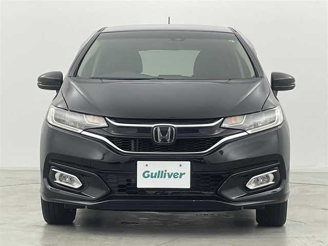ホンダ フィット 13G L ホンダセンシング 群馬県 2019(令1)年 4.2万km クリスタルブラックパール 社外ナビ(CN-RE05D)/AM/FM/CD/DVD/BT/フルセグ/バックカメラ/ETC/ホンダセンシング/・衝突軽減ブレーキ〈CMBS〉/・誤発進抑制機能/・歩行者事故低減ステアリング/・路外逸脱抑制機能/・ACC〈アダプティブ・クルーズ・コントロー〉/・LKAS〈車線維持支援システム〉/・先行車発進お知らせ機能/・標識認識機能/アイドリングストップ/LEDヘッドライト/175/70R14 アルミホイール付きスタッドレスタイヤ4本車載/スマートキー/プッシュスタート