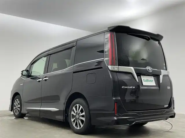 トヨタ エスクァイア ハイブリッド Gi 岡山県 2020(令2)年 7万km ボルドーマイカメタリック 純正9インチメモリナビゲーション		/【フルセグ/Bluetooth/DVD/MSV】/１２．１インチフリップダウンモニター/モデリスタエアロ		/バックカメラ		/純正15inアルミホイール+サマータイヤ：装着		/クルーズコントロール		/ビルトインETC		/LEDヘッドライト（AUTO機能付き）		/シートヒーター		/横滑り防止機能		/衝突軽減システム		/車線逸脱防止システム		/社外ドライブレコーダー				/プッシュスタート		/コーナーセンサー				/純正フロアマット		/新車保証書		/取扱説明書		/スペアキー×１