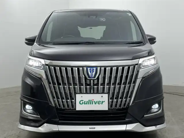 トヨタ エスクァイア ハイブリッド Gi 岡山県 2020(令2)年 7万km ボルドーマイカメタリック 純正9インチメモリナビゲーション		/【フルセグ/Bluetooth/DVD/MSV】/１２．１インチフリップダウンモニター/モデリスタエアロ		/バックカメラ		/純正15inアルミホイール+サマータイヤ：装着		/クルーズコントロール		/ビルトインETC		/LEDヘッドライト（AUTO機能付き）		/シートヒーター		/横滑り防止機能		/衝突軽減システム		/車線逸脱防止システム		/社外ドライブレコーダー				/プッシュスタート		/コーナーセンサー				/純正フロアマット		/新車保証書		/取扱説明書		/スペアキー×１