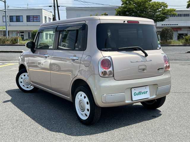 スズキ ラパン ショコラ X 鳥取県 2015(平27)年 6.6万km シャンパンピンクPM 純正ＣＤオーディオ/専用レザーシート/専用革巻きハンドル/キセノンライト/プッシュスタート/純正アルミホイール/プッシュスタート/アイドリングストップ/ウィンカーミラー/電動格納ミラー/オートライト/ドアバイザー/フロアマット
