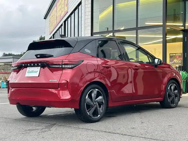 日産 オーラ G レザーエディション 愛媛県 2022(令4)年 1.9万km ガーネットレッド/スーパーブラック 2トーン 純正9型NissanConnectナビ/BOSEパーソナルプラスサウンドシステム/全周囲カメラ/プロパイロット/純正ドライブレコーダー/インテリジェントルームミラー/ブラインドスポットモニター/ワイヤレス充電/クリアランスソナー/電動パーキングブレーキ/AutoHold/電格ミラー/ステアリングリモコン/ISOFIX/現状サマー(純正AW)(205/50/R17)/BRIDGESTONE TURANZA T005A