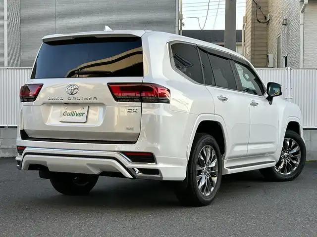 トヨタ ランドクルーザー ZX 栃木県 2024(令6)年 0.4万km プレシャスホワイトパール ワンオーナー/サンルーフ/JBLプレミアムサウンドシステム/リヤエンターテインメントシステム/モデリスタエアロ/寒冷地仕様/ヘッドアップディスプレイ/パワーバックドア/純正20inAW/ベージュレザーシート/メーカーOPナビ/フルセグTV/BT/Carplay/マルチテレインモニター/TOYOTAセーフティセンス/プリクラッシュセーフティ/レーントレーシングアシスト/ドライバー異常時対応システム/レーダークルーズコントロール/ロードサインアシスト/アダプティブハイビーム/オートハイビーム/ブラインドスポットモニター