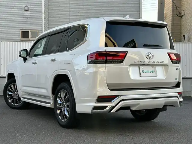 トヨタ ランドクルーザー ZX 栃木県 2024(令6)年 0.4万km プレシャスホワイトパール ワンオーナー/サンルーフ/JBLプレミアムサウンドシステム/リヤエンターテインメントシステム/モデリスタエアロ/寒冷地仕様/ヘッドアップディスプレイ/パワーバックドア/純正20inAW/ベージュレザーシート/メーカーOPナビ/フルセグTV/BT/Carplay/マルチテレインモニター/TOYOTAセーフティセンス/プリクラッシュセーフティ/レーントレーシングアシスト/ドライバー異常時対応システム/レーダークルーズコントロール/ロードサインアシスト/アダプティブハイビーム/オートハイビーム/ブラインドスポットモニター