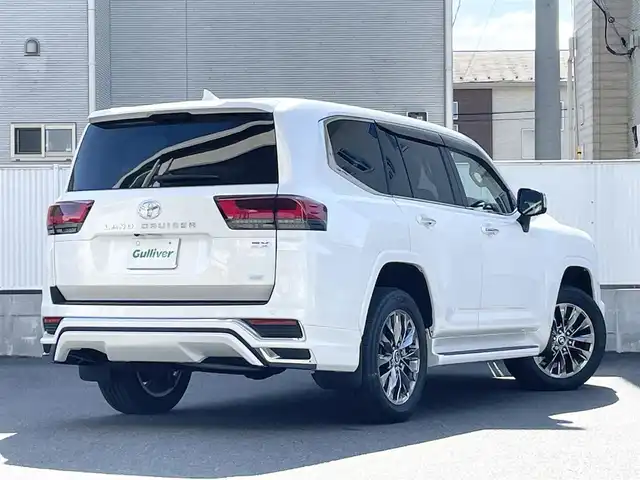トヨタ ランドクルーザー ZX 栃木県 2024(令6)年 0.4万km プレシャスホワイトパール ワンオーナー/サンルーフ/JBLプレミアムサウンドシステム/リヤエンターテインメントシステム/モデリスタエアロ/寒冷地仕様/ヘッドアップディスプレイ/パワーバックドア/純正20inAW/ベージュレザーシート/メーカーOPナビ/フルセグTV/BT/Carplay/マルチテレインモニター/TOYOTAセーフティセンス/プリクラッシュセーフティ/レーントレーシングアシスト/ドライバー異常時対応システム/レーダークルーズコントロール/ロードサインアシスト/アダプティブハイビーム/オートハイビーム/ブラインドスポットモニター