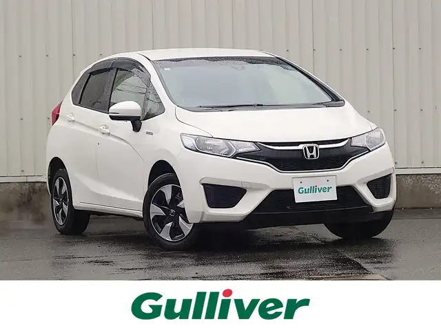 ホンダ フィット ハイブリット Fパッケージ 山形県 2016(平28)年 5.2万km タフホワイトⅡ 4WD/衝突被害軽減システム/メモリナビ/　　【CD DVD BT USB AUX】/アイドリングストップ/電動格納ウィンカーミラー/ワイパーデアイサー/フロアマット/ドアバイザ―/AAC/スマートキー/ETC
