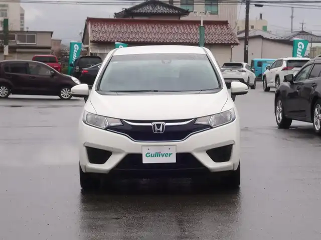 ホンダ フィット ハイブリット Fパッケージ 山形県 2016(平28)年 5.2万km タフホワイトⅡ 4WD/衝突被害軽減システム/メモリナビ/　　【CD DVD BT USB AUX】/アイドリングストップ/電動格納ウィンカーミラー/ワイパーデアイサー/フロアマット/ドアバイザ―/AAC/スマートキー/ETC