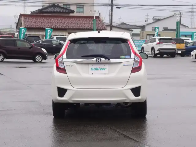 ホンダ フィット ハイブリット Fパッケージ 山形県 2016(平28)年 5.2万km タフホワイトⅡ 4WD/衝突被害軽減システム/メモリナビ/　　【CD DVD BT USB AUX】/アイドリングストップ/電動格納ウィンカーミラー/ワイパーデアイサー/フロアマット/ドアバイザ―/AAC/スマートキー/ETC