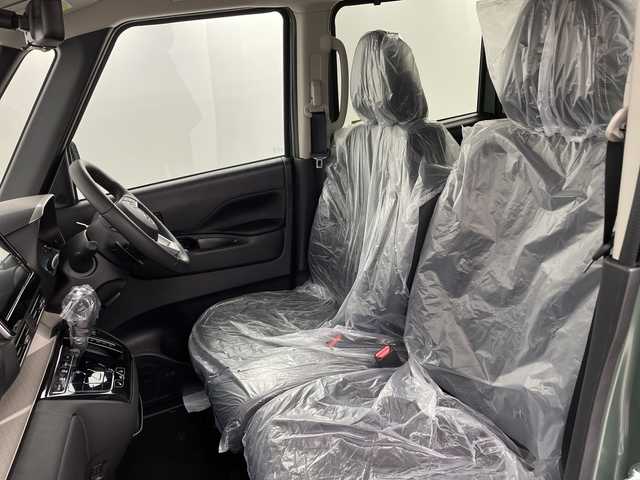 三菱 デリカミニ T プレミアム 新潟県 2025(令7)年 0.1千km 緑Ⅱ 4WD/MI-PILOT/純正9インチディスプレイオーディオ/Bluetooth/アラウンドビューモニター/両側パワースライド/レーダークルーズコントロール/LEDオートライト/ハーフレザーシート/シートヒーター/純正15インチアルミホイール/ルーフレール/デジタルインナーミラー/パドルシフト/電格ミラー/ウィンカーミラー/ステアリングヒーター/スマートキー