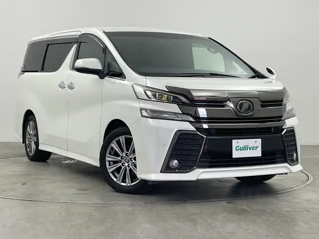 トヨタ ヴェルファイア Z Aエディション 群馬県 2016(平28)年 10万km ホワイトパールクリスタルシャイン １２．８型後部席モニター　アルパイン１１型ナビ　フルセグＴＶ　バックカメラ　クルーズコントロール　電動リアゲート　両側電動スライドドア　スマートキー　ウッドコンビステアリング　ＬＥＤ　ＥＴＣ　禁煙車