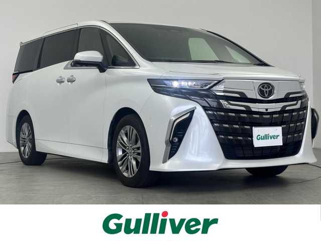 トヨタ アルファードハイブリット Z 愛知県 2024(令6)年 1.9万km プラチナホワイトパールマイカ モデリスタ　/　　・フロントグリル/ユニバーサルステップ/純正フリップダウンモニター/左右独立ムーンルーフ/サイドエンブレムイルミネーション/トヨタチームメイト/　　・アドバンスドライブ/　　・アドバンストパーク/　　・ドライバー異常時対応システム/ドライブレコーダー（前後）/デジタルインナーミラー/純正コネクテッドナビ対応ディスプレイオーディオ/(フルセグ/BT/HDMI/スマホ連動)/ビルトインETC/パノラミックビューモニター/トヨタセーフティセンス/BSM/USB充電ポート/置くだけ充電/HUD/ステアリングリモコン/ステアリングヒーター/パワーシート/メモリーシート/1・2列目シートヒーター/1・2列目ベンチレーション/両側パワースライドドア/サイドサンシェード