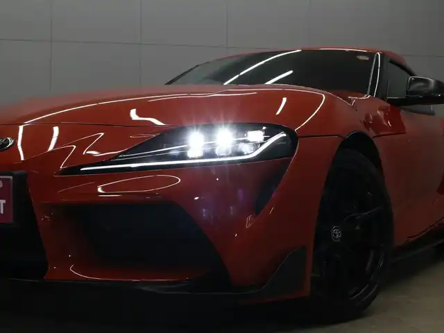 トヨタ スープラ RZ プラズマオレンジ100ED 三重県 2024(令6)年 0.7万km オレンジ 100台限定車/専用ボディ色プラズマオレンジ(D19)/ワンオーナー /プリクラッシュセーフティ/レーンディパーチャーアラート/ブラインドスポットモニター/HDDナビゲーションシステム/・8.8インチタッチディスプレイ/・地デジTV/・HDDオーディオ/・Toyota Supra Connect/・Bluetooth/JBLプレミアムサウンドシステム(12スピーカー)/バックカメラ/リアクロストラフィックアラート/ブラックアルカンターラ/革コンビシート/・シートヒーター/パワーシート/コムテック前後ドライブレコーダー/ユピテルGPSレーダー探知機/ETC/純正19インチ10本スポークマットブラック塗装鍛造アルミホイール/「GR」ロゴ入brembo製ブラックブレーキキャリパー（フロント）/6灯式LEDヘッドランプ/・アダプティブハイビーム/オートライト/プッシュエンジンスタート/スマートキー/新車時保証書/取扱説明書