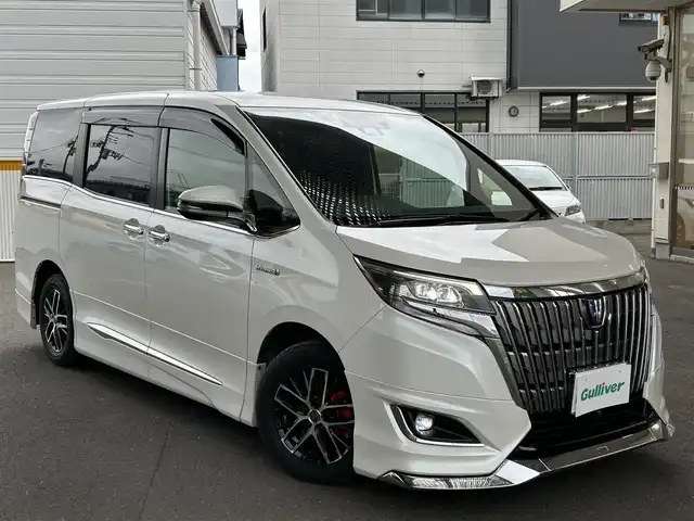 トヨタ エスクァイア ハイブリッド Gi 宮城県 2017(平29)年 7.4万km ホワイトパールクリスタルシャイン 社外ナビ/（アルパイン）/（フルセグTV/Bluetooth/CD/DVD/USB)/・バックカメラ/・ドライブレコーダー/・クルーズコントロール/・レーンキープアシスト/・衝突軽減装置/・両側パワースライドドア/・革シート/・前席シートヒーター/・モデリスタ　フロントバンパー/・革ステアリング/・ステアリングスイッチ/・電動格納ウィンカーミラー/・電動パーキングブレーキ/・ETC/・ISOFIX/・LEDライト/・フロントフォグランプ/・オートライト/・オートハイビーム/・社外15インチアルミホイール/・Wエアバッグ/ABS/・フロアマット/・バイザー/・リアプライバシーガラス/・スペアキー×1/・スマートキー/・プッシュスタート/・保証書/・取扱説明書