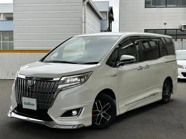 トヨタ エスクァイア ハイブリッド Gi 宮城県 2017(平29)年 7.4万km ホワイトパールクリスタルシャイン 社外ナビ/（アルパイン）/（フルセグTV/Bluetooth/CD/DVD/USB)/・バックカメラ/・ドライブレコーダー/・クルーズコントロール/・レーンキープアシスト/・衝突軽減装置/・両側パワースライドドア/・革シート/・前席シートヒーター/・モデリスタ　フロントバンパー/・革ステアリング/・ステアリングスイッチ/・電動格納ウィンカーミラー/・電動パーキングブレーキ/・ETC/・ISOFIX/・LEDライト/・フロントフォグランプ/・オートライト/・オートハイビーム/・社外15インチアルミホイール/・Wエアバッグ/ABS/・フロアマット/・バイザー/・リアプライバシーガラス/・スペアキー×1/・スマートキー/・プッシュスタート/・保証書/・取扱説明書
