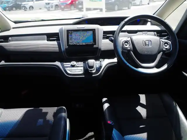ホンダ フリード ハイブリット G ホンダセンシング 千葉県 2020(令2)年 4.4万km シーグラスブルーパール 185/65R15/ホンダセンシング/・衝突軽減ブレーキ（CMBS）/・車線維持支援システム（LKAS）/・アダプティブクルーズコントロール（ACC）/・後方誤発進抑制機能/・誤発進抑制機能/ハーフレザーシート/前席シートヒーター/社外SDナビ/地デジTV/【DVD/CD再生機能　Bluetooth接続】/バックカメラ/フリップダウンモニター/革巻きステアリング/ステアリングスイッチ/ETC/LEDヘッドライト/フォグライト/ウインカーミラー/リアコーナーセンサー/純正15インチアルミホイル/Honda スマートキー
