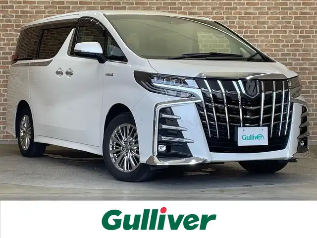 トヨタ アルファードハイブリット SR Cパッケージ 岩手県 2020(令2)年 4万km ホワイトパールクリスタルシャイン ４WD/リヤエンターテインメントシステム/メッキガーニッシュ/パーキングアシスト/リヤエンターテインメントシステム/JBLプレミアムサウンドシステム/パノラミックビューモニター/デジタルインナーミラー/両側パワースライドドア/パワーバックドア/エグゼクティブパワーシート/トヨタセーフティセンス/プリクラッシュセーフティ/レーダークルーズコントロール/レーントレーシングアシスト/ロードサインアシスト/アダプティブハイビームシステム/クリアランスソナー/パワーシート/シートヒーター/シートベンチレーション/ステアリングヒーター/純正ナビ/ETC2.0/ドライブレコーダー/三眼LEDヘッドランプ/純正17インチアルミホイール