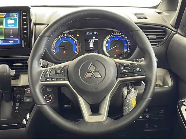 三菱 デリカミニ T プレミアム 愛知県 2025(令7)年 0.1千km 緑Ⅱ 未使用車・新車/９型ディスプレイオーディオ/全方位カメラ/Bluetooth・AppleCarPlay・AndroidAuto・USB/ルーフレール/ファブリック＆合皮シート/前席シートヒーター/ヒルディセントコントロール/ヒルスタートアシスト/アイドリングストップ/ACC/車線維持支援/車線逸脱警報/先行車発進告知/LEDヘッドライト/オートライト/オートマチックハイビーム/革巻きステアリング/ステアリングスイッチ/パドルシフト/電子パーキングブレーキ/オートホールド/スマートキー/プッシュスタート/スペアキー/新車保証書・取扱説明書