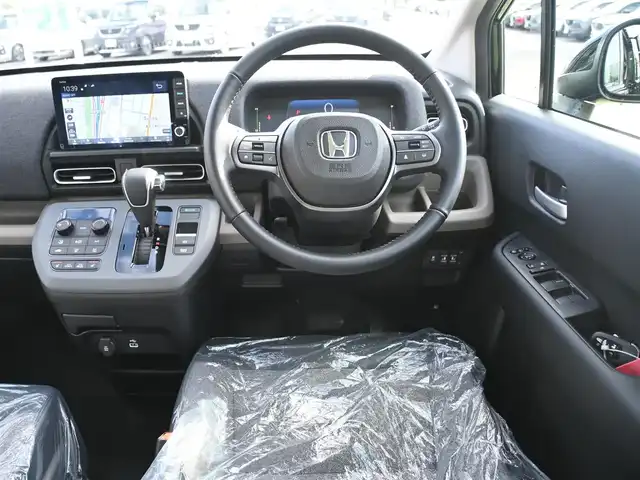 ホンダ フリード ハイブリット e:HEV AIR EX 千葉県 2025(令7)年 0.1千km クリスタルブラックパール e:HEV エアー　EX　2LB40Z　6人　9インチナビ　LXM-242ZFNI(207680円)/ホンダセンシング/・衝突軽減ブレーキ（CMBS）/・車線維持支援システム（LKAS）/・アダプティブクルーズコントロール（ACC）/・ブラインドスポットインフォメーション/・後方誤発進抑制機能/・誤発進抑制機能/両側パワースライドドア/ハーフレザーシート/前席シートヒーター/純正コネクトナビ/地デジTV/【Apple CarPlay　Android Auto対応】/【Bluetooth接続】/バックカメラ/革巻きステアリング/ステアリングスイッチ/LEDヘッドライト/ウインカーミラー/コーナーセンサー/純正15インチアルミホイル/サイド/カーテンエアバッグ/Honda スマートキー