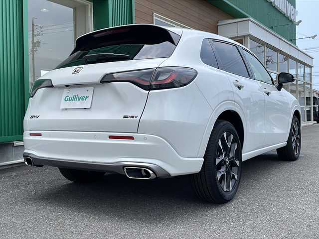 ホンダ ＺＲ－Ｖ ハイブリッド e:HEV Z 岐阜県 2024(令6)年 0.6万km プラチナホワイトパール ワンオーナー/Honda CONNECT ディスプレー（メーカー標準９インチ）/フルセグTV/AppleCarPlay/AndroidAuto/Bluetooth/USB/iPod/全方位カメラ/ホンダセンシング/レーダークルーズコントロール/衝突被害軽減システム/ブラインドスポットモニター/前後コーナーセンサー/プレミアムサウンド（BOSE）/ワイヤレス充電/本革シート（黒色）/運転席・助手席シートヒーター・ステアリングヒーター/運転席・助手席パワーシート・シートメモリ/ビルトインETC2.0/電動パーキング・ブレーキホールド/MTモード付AT・パドルシフト/LEDヘッドライト/オートライト・オートマチックハイビーム/純正18インチハイビーム/純正フロアマット・Clazzio製フロアマット（防汚のため）/スマートキー/スペアキーあり/プッシュスタート/禁煙車