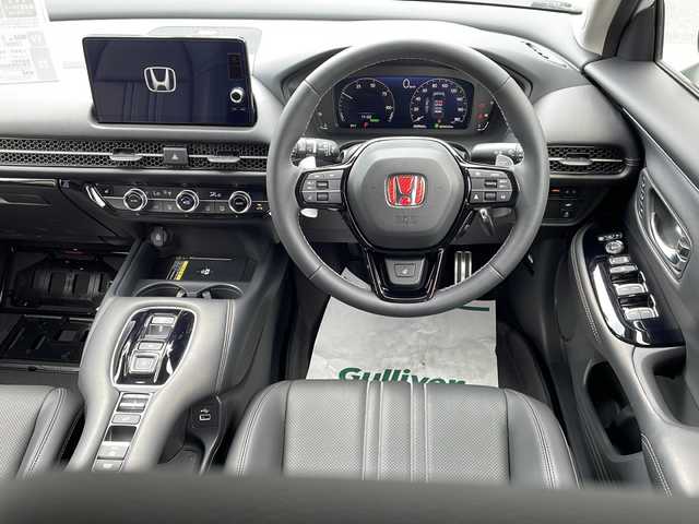 ホンダ ＺＲ－Ｖ ハイブリッド e:HEV Z 岐阜県 2024(令6)年 0.6万km プラチナホワイトパール ワンオーナー/Honda CONNECT ディスプレー（メーカー標準９インチ）/フルセグTV/AppleCarPlay/AndroidAuto/Bluetooth/USB/iPod/全方位カメラ/ホンダセンシング/レーダークルーズコントロール/衝突被害軽減システム/ブラインドスポットモニター/前後コーナーセンサー/プレミアムサウンド（BOSE）/ワイヤレス充電/本革シート（黒色）/運転席・助手席シートヒーター・ステアリングヒーター/運転席・助手席パワーシート・シートメモリ/ビルトインETC2.0/電動パーキング・ブレーキホールド/MTモード付AT・パドルシフト/LEDヘッドライト/オートライト・オートマチックハイビーム/純正18インチハイビーム/純正フロアマット・Clazzio製フロアマット（防汚のため）/スマートキー/スペアキーあり/プッシュスタート/禁煙車