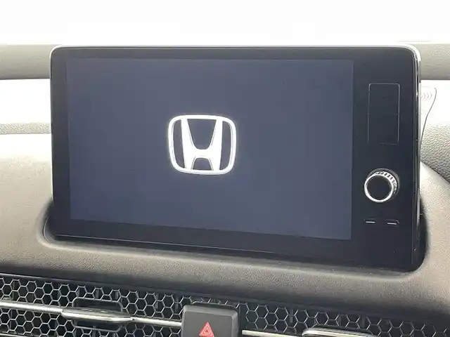 ホンダ ＺＲ－Ｖ ハイブリッド e:HEV Z 沖縄県 2023(令5)年 1.5万km クリスタルブラックパール 純正ディスプレイオーディオ/【Bluetooth/USB/AppleCarPlay/AndroidAuto/フルセグTV】/全方位カメラ/置くだけ充電/BOSEサウンド/ETC2.0/ホンダセンシング/衝突軽減ブレーキ/先行車発進お知らせ機能/歩行者事故低減ステアリング/路外逸脱抑制機能/標識認識機能/アダプティブクルーズコントロール/ブラインドスポットモニター/オートマチックハイビーム/レザーシート/・前席パワーシート/前席シートヒーター/ステアリングスイッチ/ステアリングヒーター/パドルシフト/純正エアロ/LEDヘッドライト/・オートライト/純正18インチアルミホイール/前席純正フロアマット/ABS/横滑り防止装置/ダウンヒルアシスト/プッシュスタート/スマートキー/スペアキー/取扱説明書/保証書