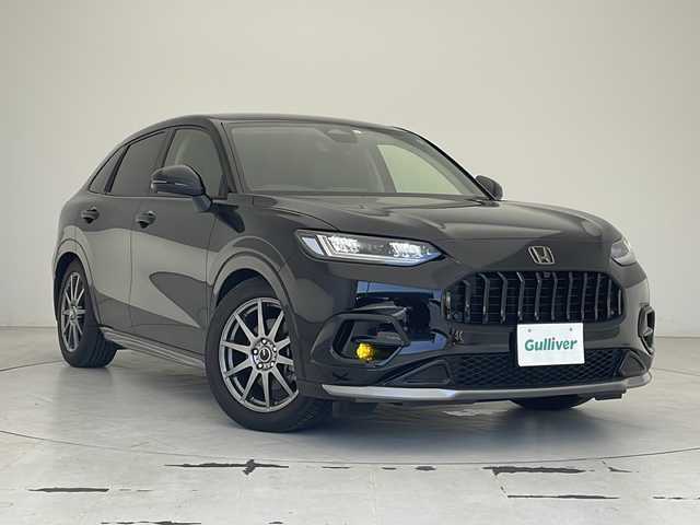 ホンダ ＺＲ－Ｖ ハイブリッド e:HEV Z 沖縄県 2023(令5)年 1.5万km クリスタルブラックパール 純正ディスプレイオーディオ/【Bluetooth/USB/AppleCarPlay/AndroidAuto/フルセグTV】/全方位カメラ/置くだけ充電/BOSEサウンド/ETC2.0/ホンダセンシング/衝突軽減ブレーキ/先行車発進お知らせ機能/歩行者事故低減ステアリング/路外逸脱抑制機能/標識認識機能/アダプティブクルーズコントロール/ブラインドスポットモニター/オートマチックハイビーム/レザーシート/・前席パワーシート/前席シートヒーター/ステアリングスイッチ/ステアリングヒーター/パドルシフト/純正エアロ/LEDヘッドライト/・オートライト/純正18インチアルミホイール/前席純正フロアマット/ABS/横滑り防止装置/ダウンヒルアシスト/プッシュスタート/スマートキー/スペアキー/取扱説明書/保証書