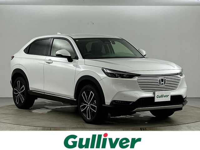 ホンダ ヴェゼル ハイブリッド e:HEV Z 愛知県 2024(令6)年 0.9万km プラチナホワイトパール ワンオーナー/禁煙車/純正9インチナビ/（AM/FM/Bluetooth/USB/フルセグTV）/バックカメラ/シーケンシャルウインカー/ワイヤレス充電/ホンダセンシング/・衝突軽減ブレーキ/・レーダークルーズコントロール/・レーンキープアシスト/・オートマチックハイビーム/・ブラインドスポットモニター/・クリアランスソナー/ダウンヒルアシスト/ETC2.0/ステアリングヒーター/シートヒーター/パドルシフト/スマートキー/プッシュスタート/LEDヘッドライト/フロントフォグライト/純正18インチアルミホイール/純正フロアマット