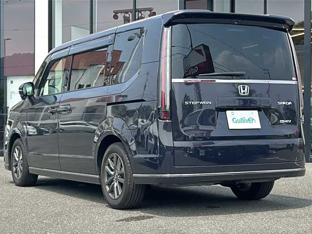 ホンダ ステップワゴン スパーダ eHEV 大阪府 2023(令5)年 1万km トワイライトミストブラックパール 純正１１．４インチナビ/純正１５．６インチフリップダウンモニター/両側パワースライドドア/前席シートヒーター /フルセグＴＶ/Ｂｌｕｅｔｏｏｔｈ/ＣＤ／ＤＶＤ/ＵＳＢ端子/レーダークルーズコントロール/電動リアゲート/オットマン/ブレーキホールド/BSM/ETC/スマートキー/LEDヘッドライト/取扱説明書/保証書