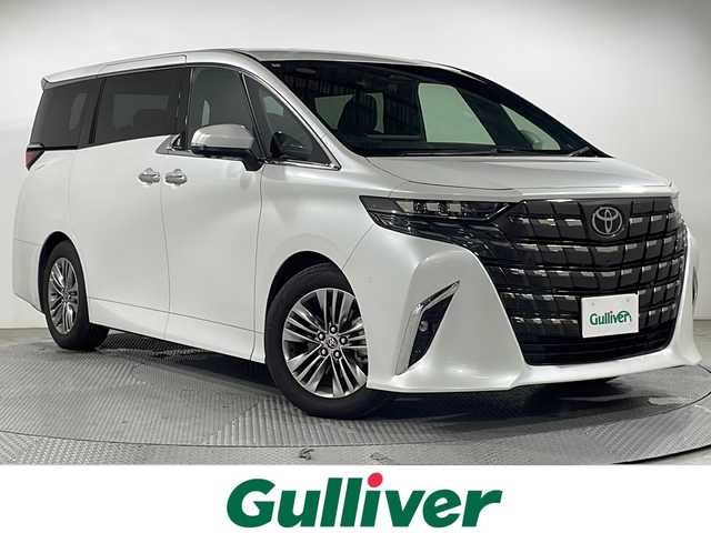 トヨタ アルファード Z 広島県 2024(令6)年 1万km プラチナホワイトパールマイカ 禁煙車/純正１４型コネクティッドナビ/サンルーフ/フリップダウンモニター/ユニバーサルステップ/パワーシート/温冷シート/ブラインドスポットモニター/パーキングアシスト/両側パワースライドドア/電動リアゲート/デジタルインナーミラー/ヘッドアップディスプレイ/ワイヤレス充電/レーダークルーズコントロール/レーンキープ/衝突軽減/踏み間違い防止/オットマン/ステアリングヒーター/100V電源/純正18インチアルミホイール(225/60/R18)/エアバッグ(運転席/助手席/サイド/カーテン)