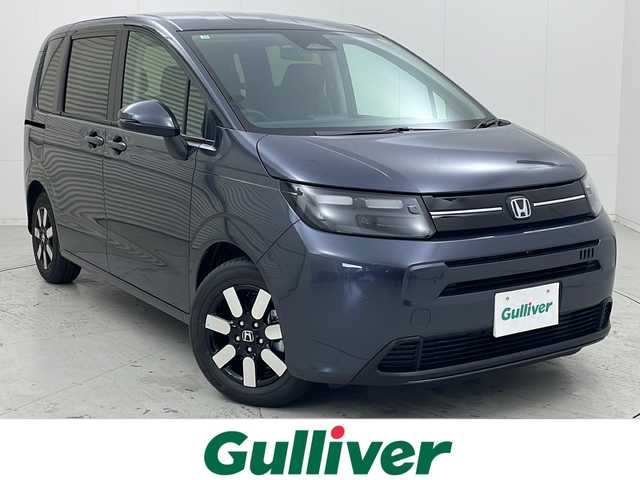 ホンダ フリード ハイブリット e:HEV AIR EX 茨城県 2025(令7)年 0.1千km メテオロイドグレーメタリック 純正9インチナビ/BT・TV・Apple Car Play・AndroidAuto/両側パワースライドドア/CMBS/ACC/レーンキープアシスト/ブラインドスポットインフォメーション/標識認識機能/シートヒーター/ハーフレザー/オートマチックハイビーム/LEDヘッドライト/革巻きステアリング/ステアリングリモコン/プッシュスタート/スペアキー/電動パーキングブレーキ/オートブレーキホールド/純正15インチアルミホール