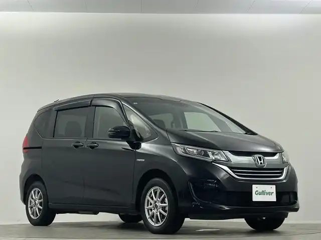 ホンダ フリード ハイブリット G ホンダセンシング 埼玉県 2019(平31)年 2.7万km プレミアムスパークルブラックパール 純正９型ナビ　フリップダウンモニター　バックカメラ　両側パワースライドドア　シートヒーター　ホンダセンシング　ＬＥＤヘッドライト　ビルトインETC　フォグランプ　スマートキー　フロアマット　禁煙車