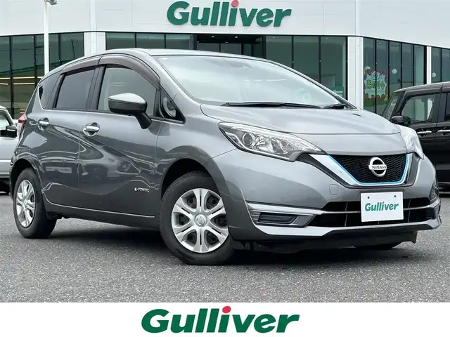 日産 ノート e－パワー X 島根県 2016(平28)年 6.4万km ダークメタルグレー 登録時走行距離63808km/純正ナビ(CD・DVD・AM・FM)/パワーステアリング/パワーウィンドウ/スマートキー(スペアキー×1)/純正フロアマット/ドアバイザー/ウィンカーミラー/レーンキープアシスト/横滑り防止装置/衝突被害軽減ブレーキ/オートライト/LEDヘッドライト/運転席・助手席エアバッグ/取扱説明書/禁煙車
